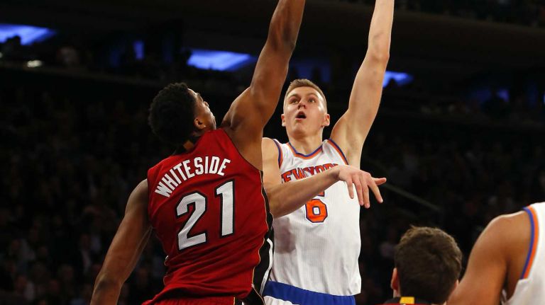 Knicks vs. Heat 24 Kristaps Porzingis #6 of the New York Knicks puts up a shot in the first half against Hassan Whiteside #21 of the Miami Heat at Madison Square Garden on Friday, Nov. 27, 2015 in New York City.