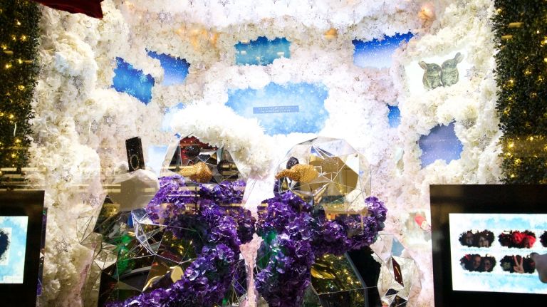 Heighten your senses with the windows at Bloomingdale's 13 These festive snowmen are ready for the holidays! They are set in a winter wonderland scene of white flowers that includes interactive screens. Viewers become part of the experience by taking their photo in front of the window while hugging someone special.