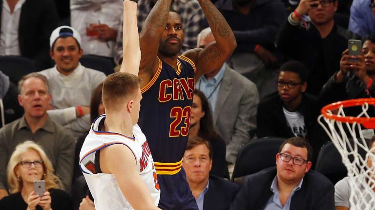 LeBron James #23 of the Cleveland Cavaliers puts up a fourth quarter shot against Kristaps Porzingis #6 of the New York Knicks at Madison Square Garden on Friday, Nov. 13, 2015 in New York City.