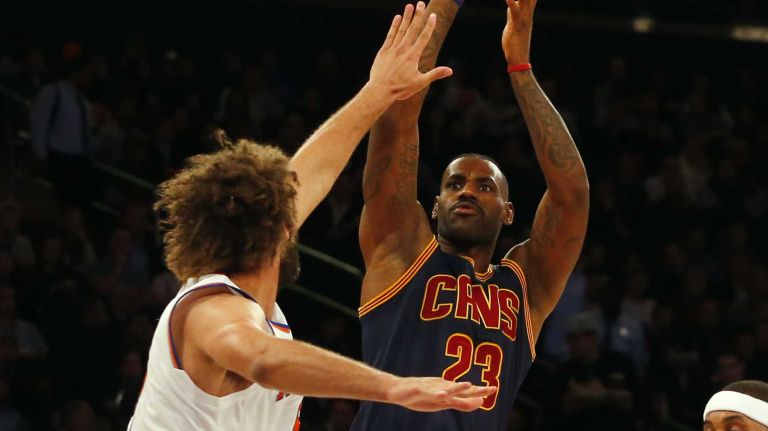 LeBron James #23 of the Cleveland Cavaliers shoots against Robin Lopez #8 of the New York Knicks in the third quarter at Madison Square Garden on Friday, Nov. 13, 2015 in New York City.