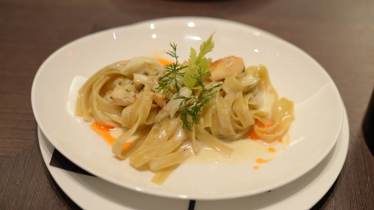 A new fall dish of soft wheat fettuccine is tossed with celery beurre blanc and hand-picked Peekytoe crabmeat from rock crabs, highly regarded as some of the freshest crabmeat in the food business. 