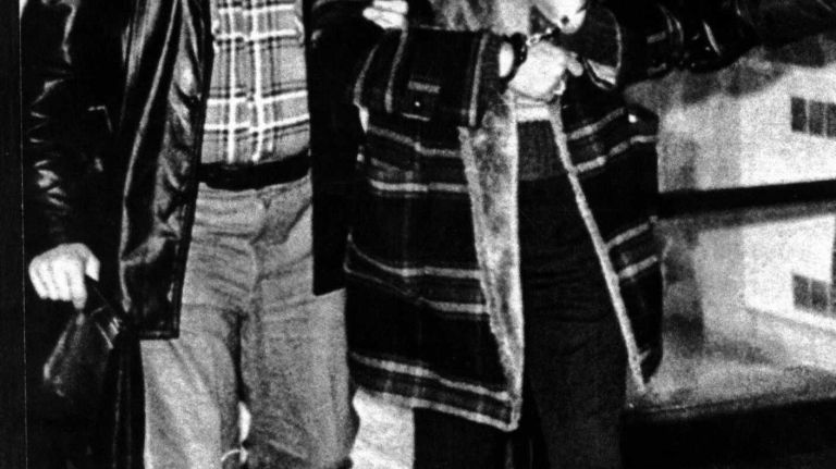 An FBI agent leads material witness Peter Gruenawald, 39, a Cargo Traffic Division operator for Lufthansa Airlines at JFK, into FBI offices in Queens, after his arrest in the $5.8 million Lufthansa robbery at JFK. (Feb. 17, 1979)