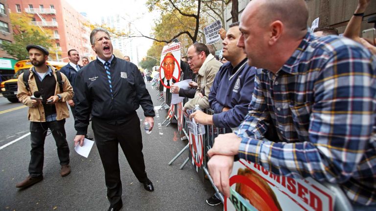 NYC Patrolmen's Benevolent Association members, led by PBA president Pat Lynch, express their discontent in Manhattan over a proposed 1 percent raise on Thursday, Nov. 5, 2015.