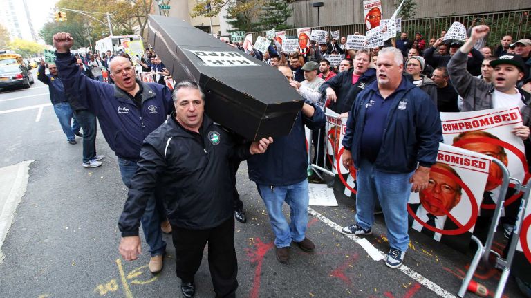 NYC Patrolmen's Benevolent Association members use strong symbolism to express their dissatisfaction with a proposed 1 percent pay raise on Nov. 5, 2015 in Manhattan.