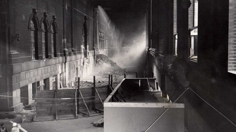 Heartbreaking photos of the demolition of the 1910 Penn Station, construction of Madison Square Garden 25 Sunlight streams through a portal in the taxi ramp on the 33rd Street side of Penn Station showing the cement dust and debris pouring through a hole in the roof where workmen were tearing out the sections of the old station on Jan. 27, 1964.