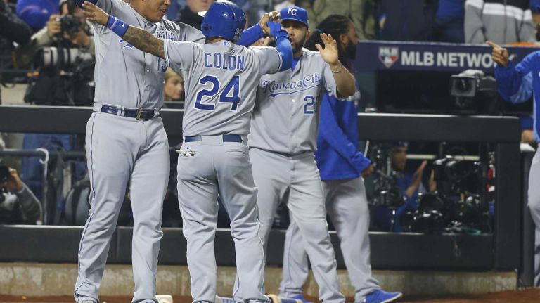 World Series Game 5: Mets vs. Royals 110 Kansas City Royals shortstop Christian Colon (24) celebrates with teammates after he scores in the 12th inning during Game 5 of the World Series against the New York Mets at Citi Field on Sunday, Nov. 1, 2015.