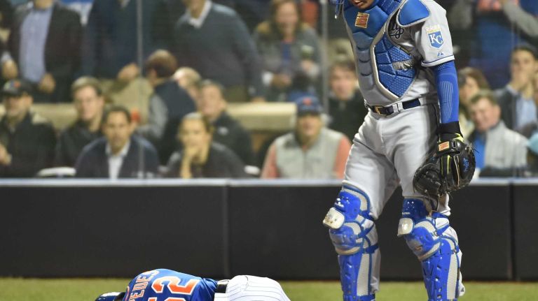 World Series Game 5: Mets vs. Royals 146 New York Mets centerfielder Yoenis Cespedes (52) lays on the ground after fouling the ball off his knee in the sixth inning during Game 5 of the World Series against the Kansas City Royals at Citi Field on Sunday, Nov. 1, 2015.