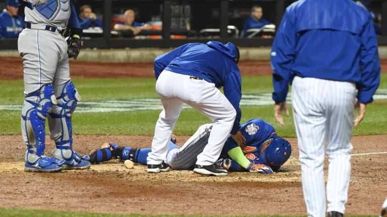 World Series Game 5: Mets vs. Royals 149 New York Mets centerfielder Yoenis Cespedes (52) is tended to after fouling the ball off his knee in the sixth inning during Game 5 of the World Series against the Kansas City Royals at Citi Field on Sunday, Nov. 1, 2015.