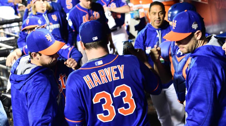 World Series Game 5: Mets vs. Royals 150 New York Mets starting pitcher Matt Harvey (33) celebrates in the dugout after the sixth inning during Game 5 of the World Series against the Kansas City Royals at Citi Field on Sunday, Nov. 1, 2015.