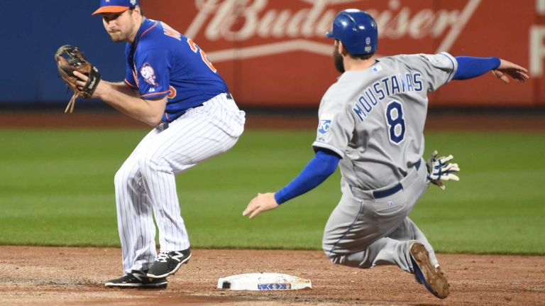 World Series Game 5: Mets vs. Royals 154 New York Mets second baseman Daniel Murphy (28) tries to turn the double play on Kansas City Royals third baseman Mike Moustakas (8) during Game 5 of the World Series at Citi Field on Sunday, Nov. 1, 2015.
