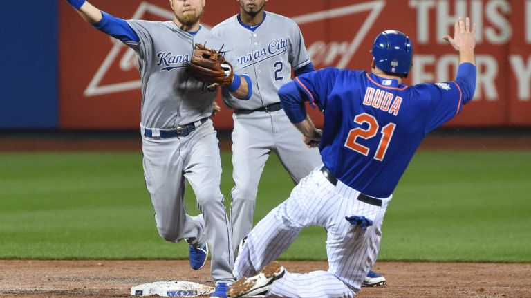 World Series Game 5: Mets vs. Royals 156 New York Mets first baseman Lucas Duda (21) is out on the double play as Kansas City Royals second baseman Ben Zobrist (18) throws to first base during Game 5 of the World Series at Citi Field on Sunday, Nov. 1, 2015.