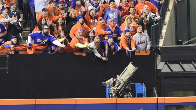 World Series Game 5: Mets vs. Royals 184 New York Mets right fielder Curtis Granderson (3) with the first inning homerun as Kansas City Royals center fielder Lorenzo Cain (6) can only watch during Game 5 of the World Series against the Kansas City Royals at Citi Field on Sunday, Nov. 1, 2015.