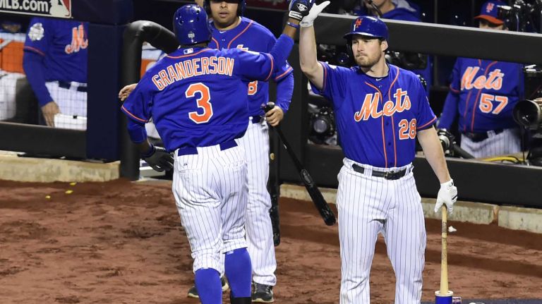 World Series Game 5: Mets vs. Royals 185 New York Mets rightfielder Curtis Granderson (3) gets the high-five from New York Mets third baseman David Wright (5) after a first-inning home run during Game 5 of the World Series against the Kansas City Royals at Citi Field on Sunday, Nov. 1, 2015.