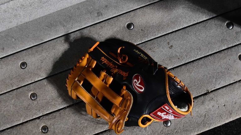 World Series Game 5: Mets vs. Royals 188 The glove of New York Mets centerfielder Yoenis Cespedes (52) is seen on the bench during warmups before Game 5 of the World Series against the Kansas City Royals at Citi Field on Sunday, Nov. 1, 2015.