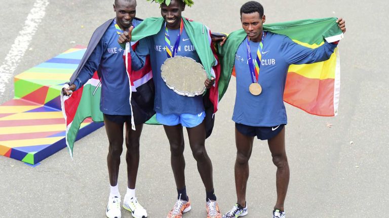 From left, second-place finisher Geoffrey Kamworor of Kenya, winner Stanley Biwott of Kenya and Lelisa Desisa of Ethiopia receive their medals for racing in the New York City Marathon in Manhattan on Sunday, Nov. 1, 2015.