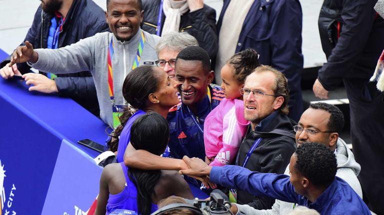 Aselefech Mergia of Ethiopia is greeted by her team after she finishes in second place in the Women's New York City Marathon in Manhattan on Sunday, Nov. 1, 2015.