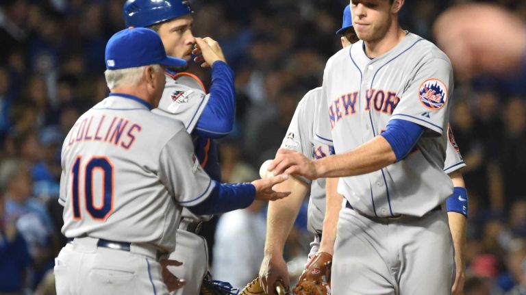New York Mets starting pitcher Steven Matz (32) hands the ball to New York Mets manager Terry Collins (10) after being taken out og the game in the fifth inning during Game 4 of the NLCS against the Chicago Cubs at Wrigley Field on Wednesday, Oct. 21, 2015.