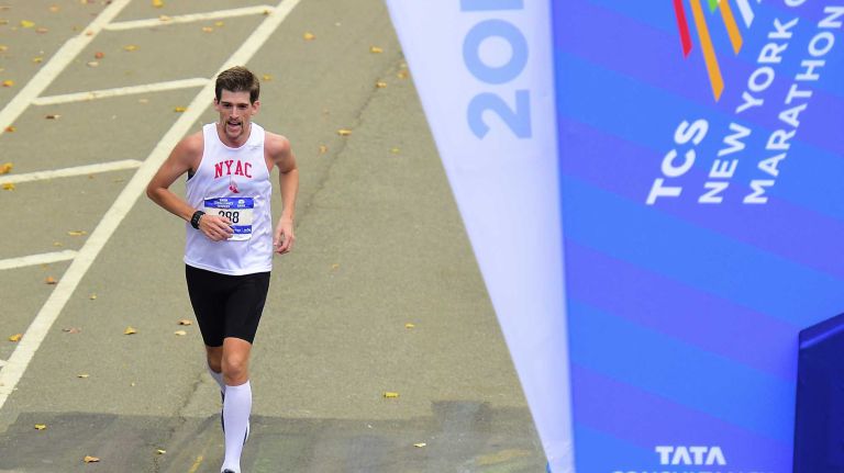 Conor Shelley of Rockville Centre crosses the finish line at the New York City Marathon in Manhattan on Sunday, Nov. 1, 2015.
