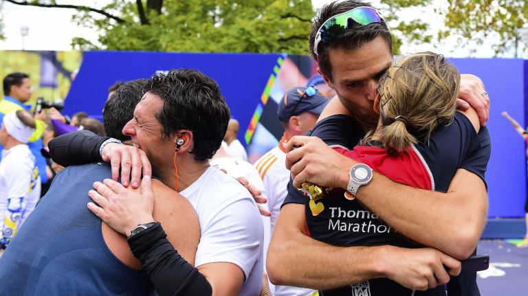 Couples embrace at the finish line of the New York City Marathon in Manhattan, on Sunday, Nov. 1, 2015.