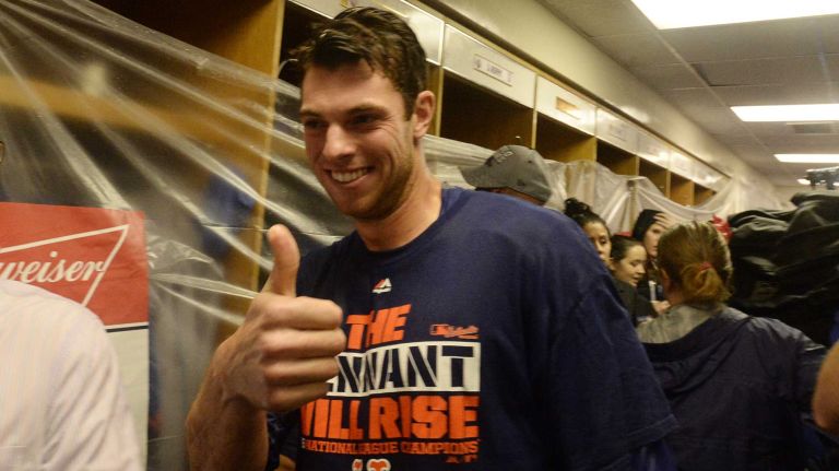 New York Mets starting pitcher Steven Matz (32) celebrates with teammates in the clubhouse after beating the Chicago Cubs in the NLCS at Wrigley Field on Wednesday, Oct. 21, 2015.