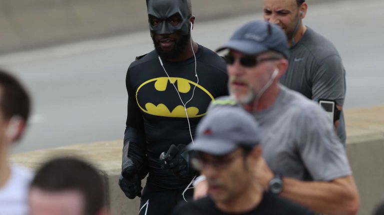 New York City Marathon participants run along the race route in Brooklyn on Nov. 1, 2015.