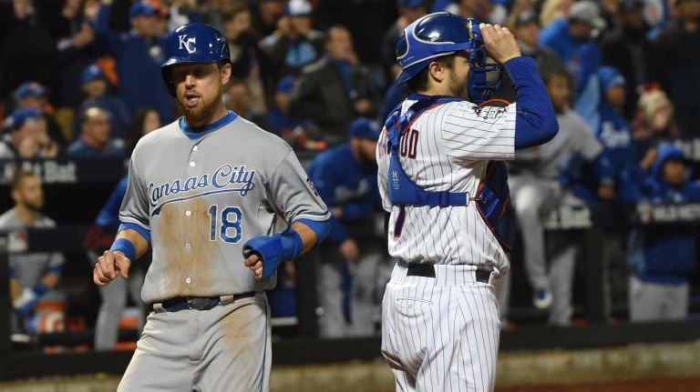 Kansas City Royals second baseman Ben Zobrist scores in the eighth inning during Game 4 of the World Series against the New York Metsat Citi Field on Saturday, Oct. 31, 2015.