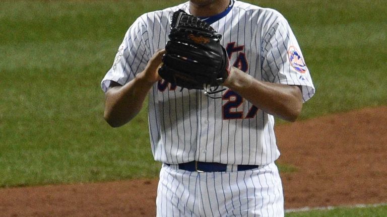 New York Mets relief pitcher Jeurys Familia reacts after Kansas City Royals second baseman Ben Zobrist scores during Game 4 of the World Series at Citi Field on Saturday, Oct. 31, 2015.