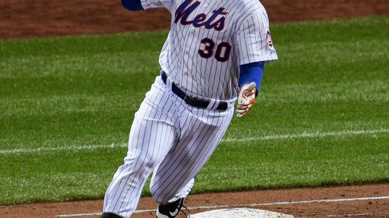 New York Mets left fielder Michael Conforto reacts after his second solo home run during Game 4 of the World Series against the Kansas City Royals at Citi Field on Saturday, Oct. 31, 2015.