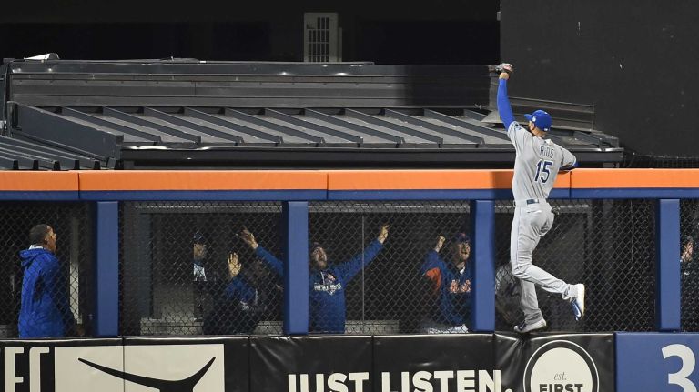 Kansas City Royals right fielder Alex Rios (15) cannot get to the homer by New York Mets left fielder Michael Conforto (30) in sixth inning during Game 4 of the World Series against the New York Mets at Citi Field on Saturday, Oct. 31, 2015.