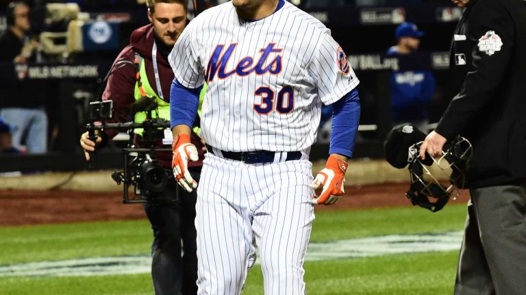 New York Mets left fielder Michael Conforto (30) reacts after his homer in the third inning during Game 4 of the World Series against the Kansas City Royals at Citi Field on Saturday, Oct. 31, 2015.