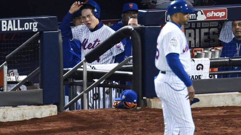 New York Mets shortstop Wilmer Flores iOS seen in the dugout after he scores during Game 4 of the World Series against the Kansas City Royals at Citi Field on Saturday, Oct. 31, 2015.