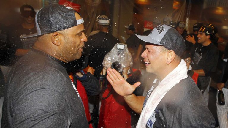 CC Sabathia and Alex Rodriguez of the New York Yankees celebrate in the locker room after defeating the Boston Red Sox at Yankee Stadium on Thursday, Oct. 1, 2015.