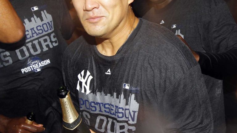 Masahiro Tanaka of the New York Yankees celebrates in the locker room after defeating the Boston Red Sox at Yankee Stadium on Thursday, Oct. 1, 2015.