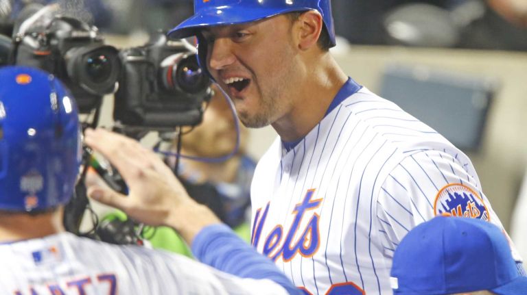 New York Mets left fielder Michael Conforto (30) celebrates his third inning homerun in dugout during Game 4 of the World Series against the Kansas City Royals at Citi Field on Saturday, Oct. 31, 2015.