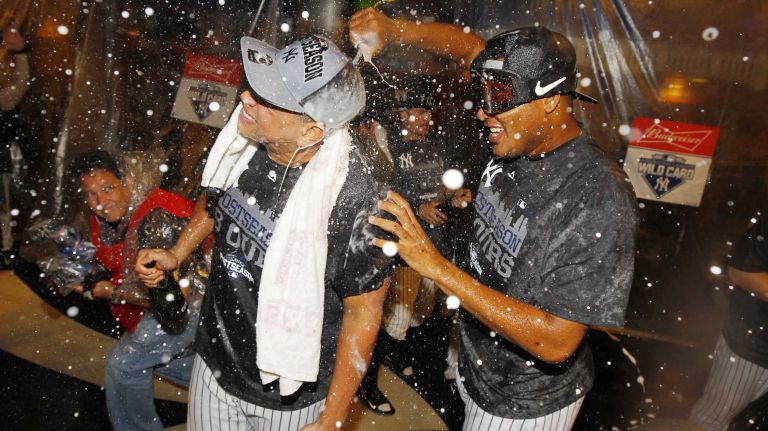 Alex Rodriguez, left, and Ivan Nova of the New York Yankees celebrate in the locker room after defeating the Boston Red Sox at Yankee Stadium on Thursday, Oct. 1, 2015.