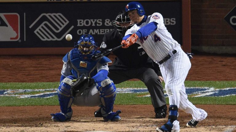 New York Mets shortstop Wilmer Flores singles during Game 4 of the World Series against the Kansas City Royals at Citi Field on Saturday, Oct. 31, 2015.
