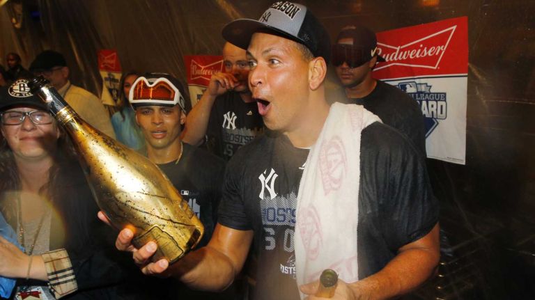 Alex Rodriguez of the New York Yankees celebrates in the locker room after defeating the Boston Red Sox at Yankee Stadium on Thursday, Oct. 1, 2015.