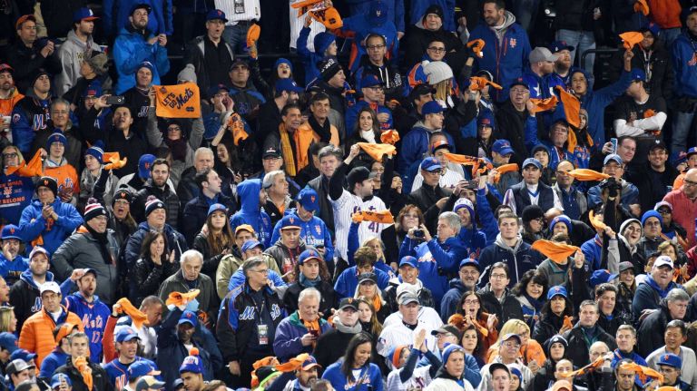 New York Mets fans swing towels before Game 4 of the World Series against the Kansas City Royals at Citi Field on Saturday, Oct. 31, 2015.
