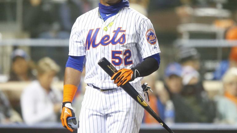 New York Mets centerfielder Yoenis Cespedes reacts after striking out in the second inning during Game 4 of the World Series against the Kansas City Royals at Citi Field on Saturday, Oct. 31, 2015.