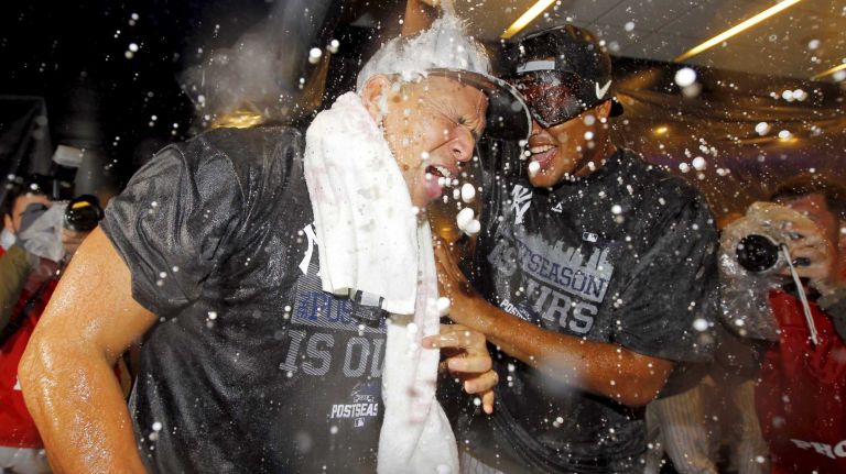 Alex Rodriguez, left, and Ivan Nova of the New York Yankees celebrate in the locker room after defeating the Boston Red Sox at Yankee Stadium on Thursday, Oct. 1, 2015.