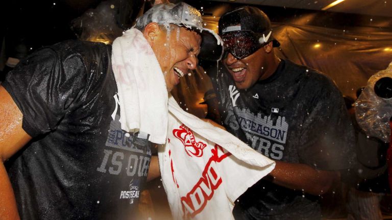 Alex Rodriguez, left, and Ivan Nova of the New York Yankees celebrate in the locker room after defeating the Boston Red Sox at Yankee Stadium on Thursday, Oct. 1, 2015.