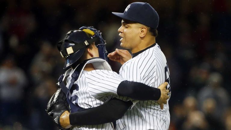 Dellin Betances and John Ryan Murphy of the New York Yankees celebrate against the Boston Red Sox at Yankee Stadium on Thursday, Oct. 1, 2015.