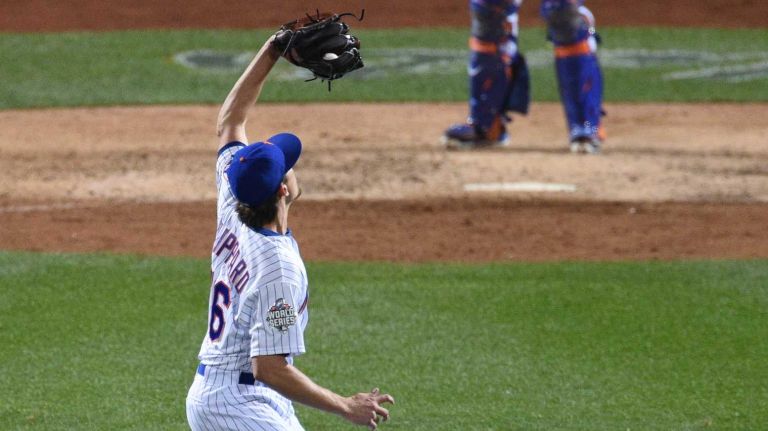 New York Mets relief pitcher Tyler Clippard catches a pop-up for the third out of the top of the eighth inning during Game 3 of the World Series against the Kansas City Royals at Citi Field on Friday, Oct. 30, 2015.