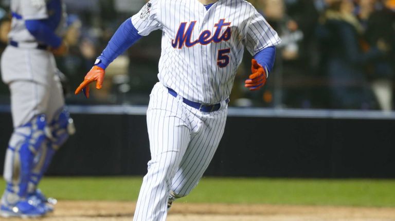 New York Mets third baseman David Wright with the two run single in the sixth inning during Game 3 of the World Series against the Kansas City Royals at Citi Field on Friday, Oct. 30, 2015.
