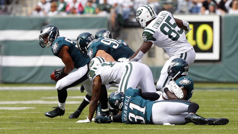 Jordan Hicks #58 of the Philadelphia Eagles recovers a fumble by Brandon Marshall #15 of the New York Jets during the second quarter at MetLife Stadium on Sunday, Sep. 27, 2015 in East Rutherford, New Jersey.