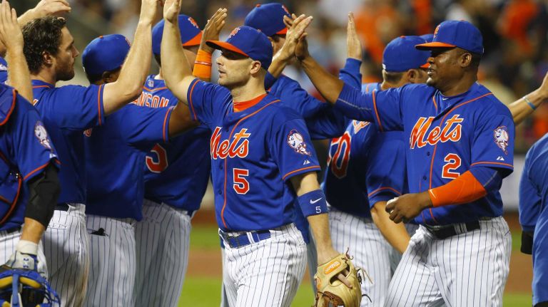 Subway Series: Yankees vs. Mets 71 David Wright and Juan Uribe of the New York Mets celebrate after defeating the New York Yankees at Citi Field on Friday, Sept. 18, 2015.
