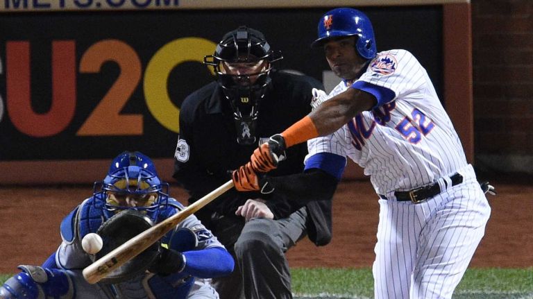 New York Mets centerfielder Yoenis Cespedes singles during Game 3 of the World Series against the Kansas City Royals at Citi Field on Friday, Oct. 30, 2015.