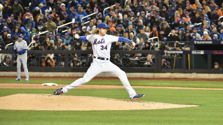 New York Mets starting pitcher Noah Syndergaard delivers the pitch in the fifth inning during Game 3 of the World Series against the Kansas City Royals at Citi Field on Friday, Oct. 30, 2015.