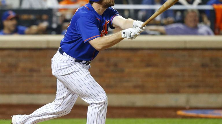 Subway Series: Yankees vs. Mets 77 Daniel Murphy of the New York Mets follows through on a sixth inning home run against the New York Yankees at Citi Field on Friday, Sept. 18, 2015.