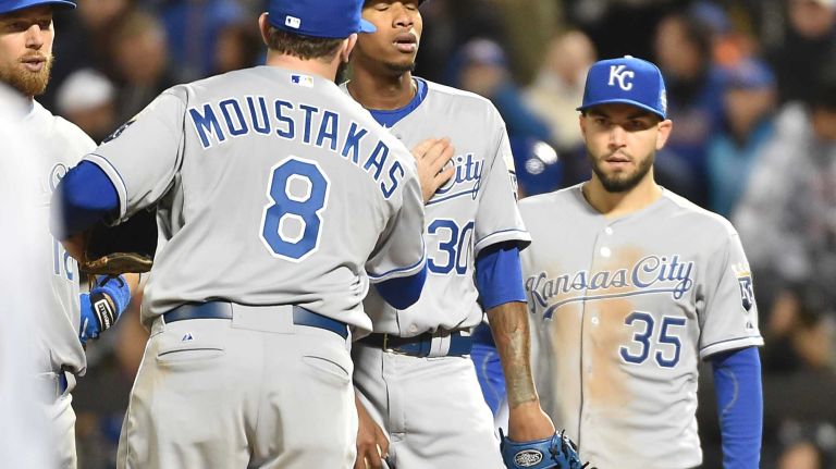 Kansas City Royals third baseman Mike Moustakas and teammates come to mound as Kansas City Royals starting pitcher Yordano Ventura is taken out of game in fourth inning during Game 3 of the World Series against the New York Mets at Citi Field on Friday, Oct. 30, 2015.